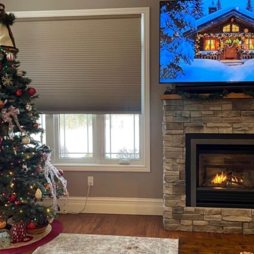 Settle in by the glowing fireplace for the coziest nights—perfect for movie time after a day in the snow.