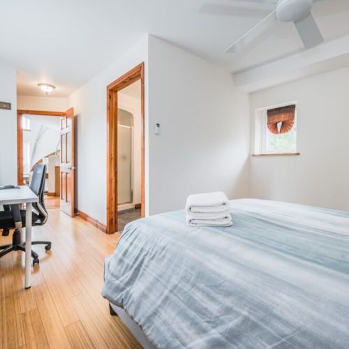 The third bedroom with ensuite bathroom and workspace.