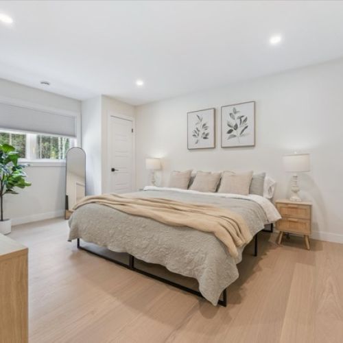 A calming retreat with soft neutrals and clean lines — this spacious bedroom blends natural textures, minimalist design, and restful light for ultimate relaxation.