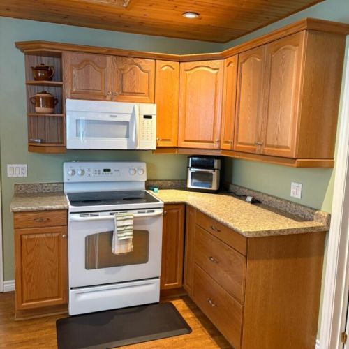 Fully equipped kitchen with plenty of counter space, perfect for cooking meals and snacks during your stay.