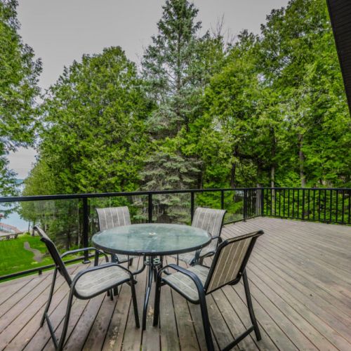 The upper deck dining table provides the perfect backdrop to the views and BBQ.