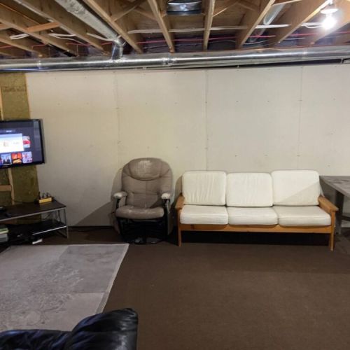 Relax and stream your favorite shows in the comfy basement lounge, offering Netflix, cozy seating, and vacation vibes.