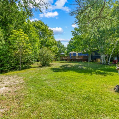 A spacious backyard offers plenty of room to relax, play, and unwind.