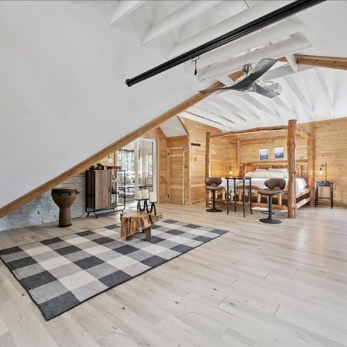 Open-concept loft living with vaulted ceilings, warm wood finishes, and lots of room to spread out. A bright and welcoming space for relaxing, working remotely, or spending time together.