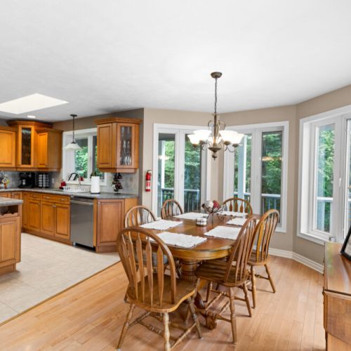 The bright dining area flows seamlessly into the kitchen, creating a welcoming space for shared meals and time together.