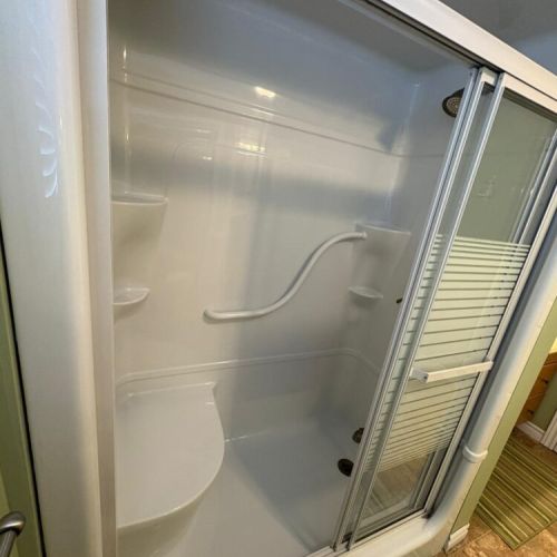 Shower interior with built-in shelving for your essentials.