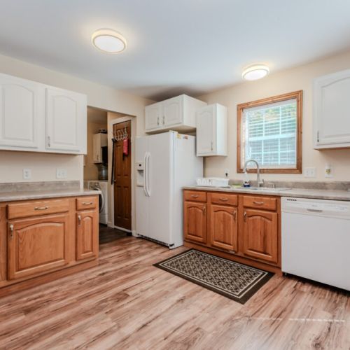 Prepare delicious meals in the fully stocked kitchen, complete with modern appliances, ample counter space, and a convenient dishwasher for easy clean-up.