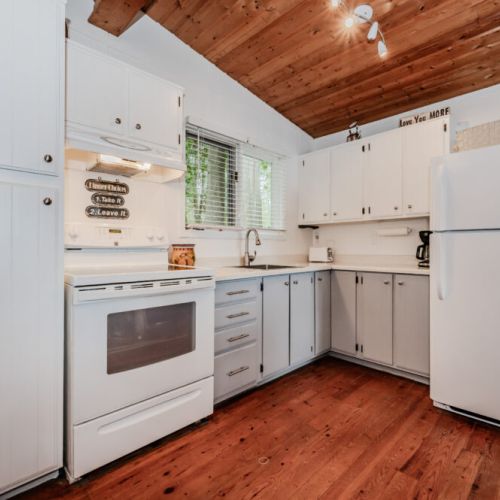 Spacious and functional, the kitchen is stocked with essentials for your stay—coffee maker, toaster, and plenty of storage for easy vacation cooking.