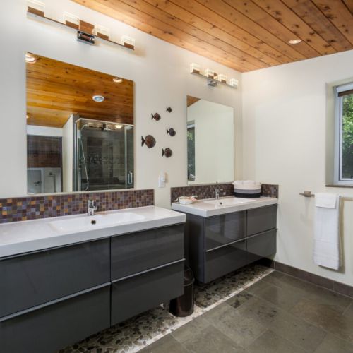 The spacious primary ensuite features double vanities and modern finishes for added comfort and convenience.