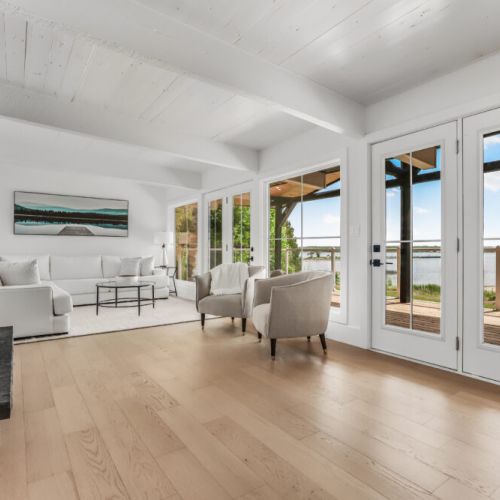 Huge windows and patio doors bring the outdoors in and lead right out to the waterfront deck.