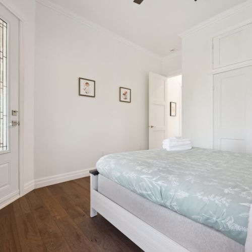 A cheerful and comfortable bedroom designed for restful nights after a day by the lake.