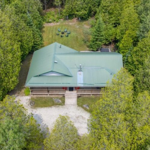 A bird’s-eye view of Pike & Pine, showcasing the welcoming front porch and large private backyard retreat.