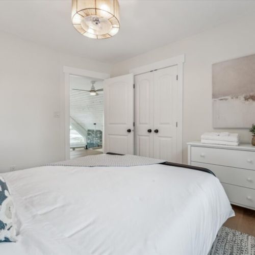 Unwind in a spacious queen suite with modern decor and natural textures for a boutique-hotel feel.