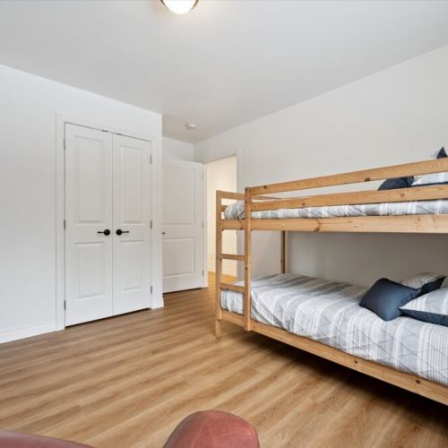 Family-friendly bunk room with sturdy wood bunks—perfect for kids or extra guests.