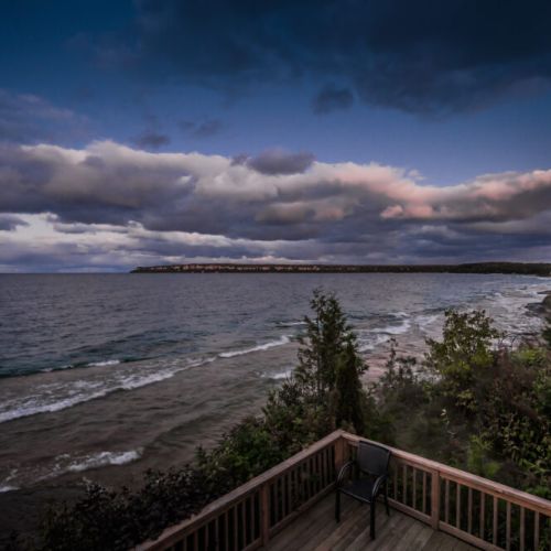 Stunning waterfront view at dusk, offering a peaceful and picturesque setting by the water.