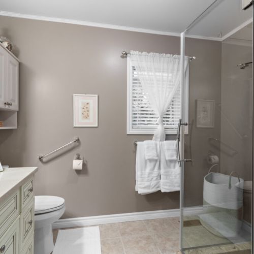 A bright, spacious bathroom with a glass-enclosed shower and plenty of room to refresh after a day of exploring.