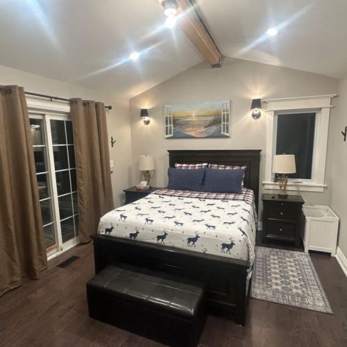 Enjoy the comfort of a queen-sized bed in the master bedroom, along with a private bathroomn featuring a tub, and walk out to a secluded deck with a swing for a peaceful retreat.