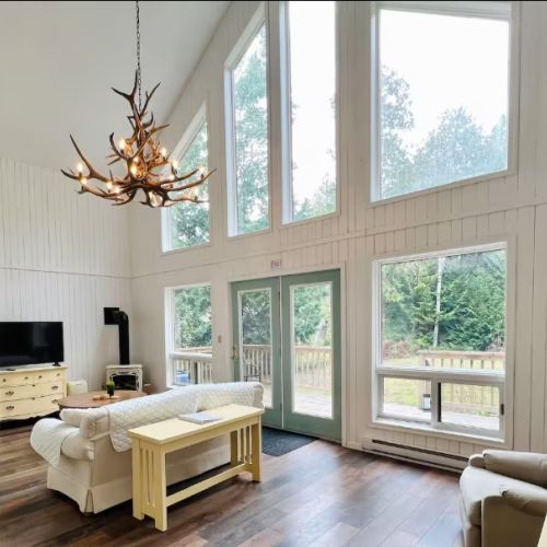 The heart of the cottage — open, sunlit, and inviting. Whether reading by the fire or enjoying a quiet morning, this is a space to slow down and reconnect.