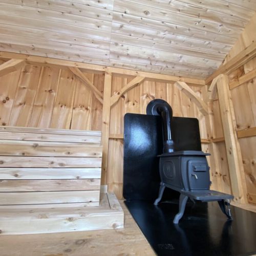 Cozy up beside the wood-burning stove in the shoreline sauna and let the gentle heat melt your stress away.