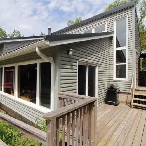 Wraparound deck with easy access to outdoor spaces—perfect for relaxing and entertaining.