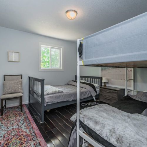Upper kids room with a bunk and double bed.