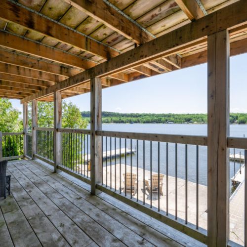 Spacious covered lounge area overlooking Georgian Bay and the waterfront below.