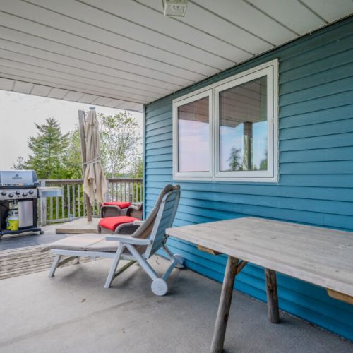 Enjoy meals or unwind in the shade on the covered deck, complete with a BBQ and cozy seating. A great spot for mornings or quiet evenings.