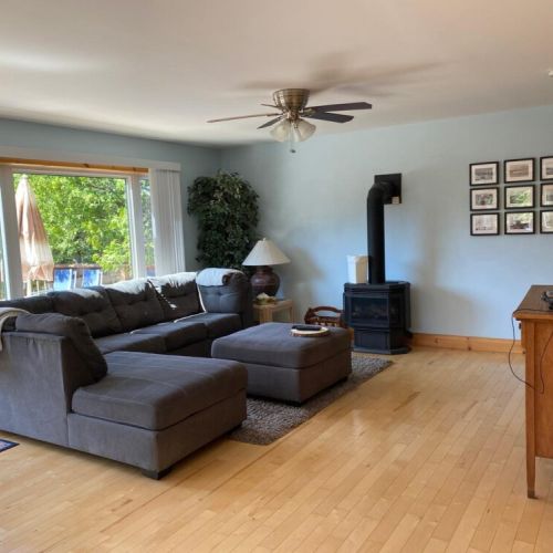 Inside, the bright living space offers modern comfort and an open layout for relaxing year-round.