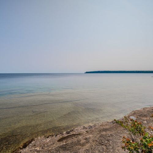 Revel in the serene, panoramic views of the lake, offering a peaceful backdrop for your cottage escape.