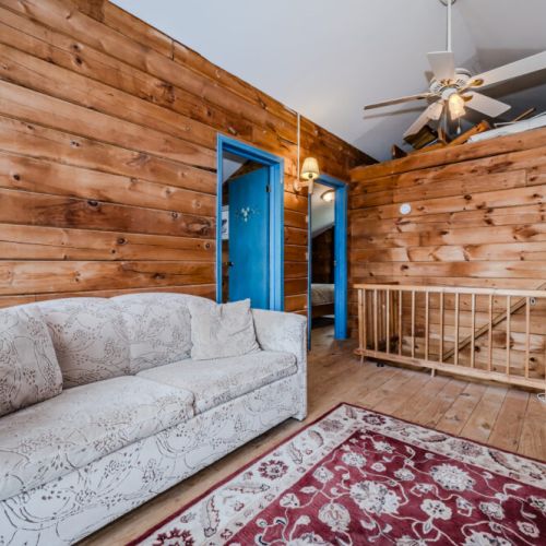 The loft area offers a cozy space to gather, play games, or simply relax with family and friends.