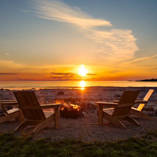Immerse yourself in breathtaking Lake Huron views. This 1.1-acre property feels like an island retreat, with the sounds of nature. Enjoy a spacious backyard, a separate fire pit, and the best sunset spot in Tobermory.