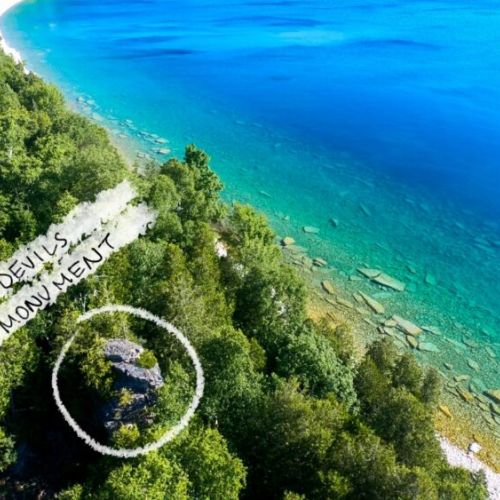 The hidden treasure of Devil's Monument is a short drive away, where the lush forest meets the pristine clarity of the bay waters.