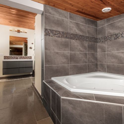 Soak in the spacious corner tub, perfect for relaxing after exploring the Bruce Peninsula.
