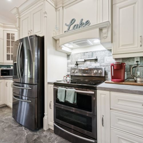 Cook with ease in the well-stocked kitchen featuring modern appliances and plenty of workspace.