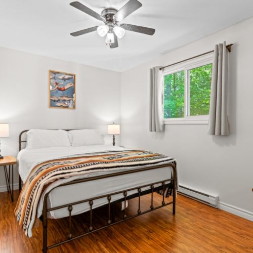 The inviting queen bedroom offers comfort after a day of exploring.