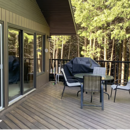 The spacious deck and BBQ with a front-row seat of the forest, offering a secluded spot for your morning coffee or a sunset toast.