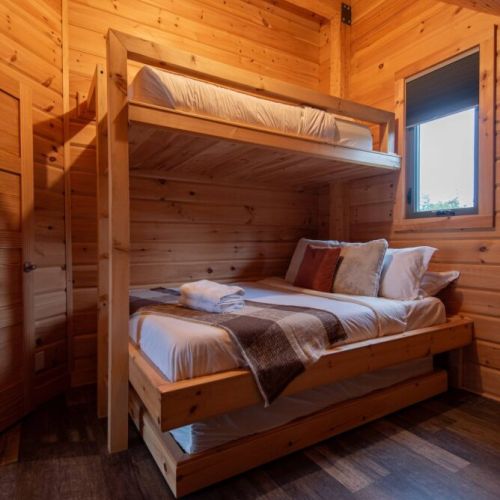 Upstairs Bedroom: Queen bunk bed with a twin bed above, and twin pull out below. 
Bedroom 3 of 3