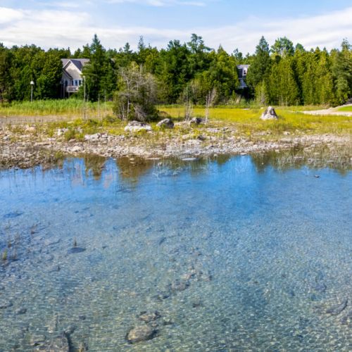 Enjoy the stunning turquoise waters and rugged shoreline just steps from Fathom Hideaway. The bay's shallow, crystal-clear water is perfect for wading, exploring, and soaking in the natural beauty of the Bruce Peninsula.