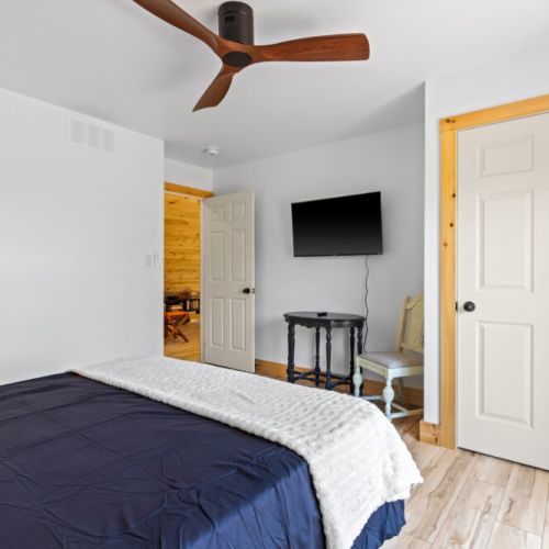 Relax in bed with a Smart TV for cozy movie nights after a day of exploring.