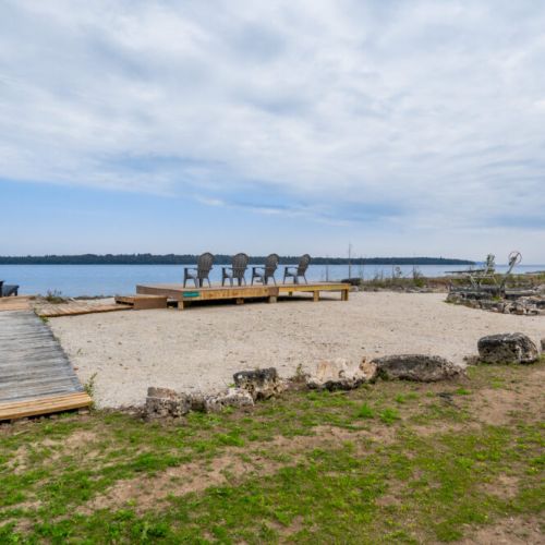 The waterfront lounge with Muskoka chairs.