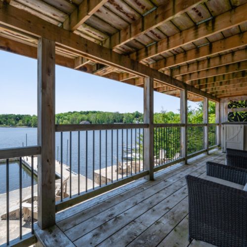 Covered deck with stunning water views—enjoy the scenery rain or shine.