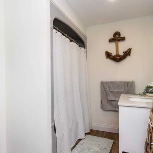 Bright and modern full bathroom with coastal-inspired touches.