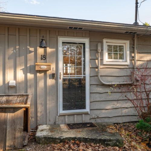 Calma Retreat's modest entrance beckons you inside for rest and rejuvenation.