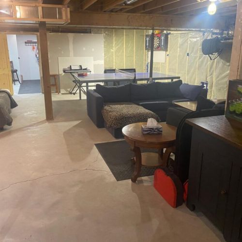 The spacious lower level is designed for fun and relaxation with comfortable seating, games, and entertainment.