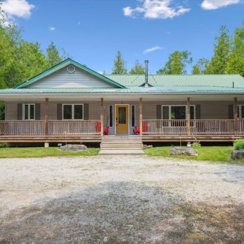 A warm welcome at the front porch—perfect for morning coffee or relaxing evenings in this Bruce Peninsula retreat.