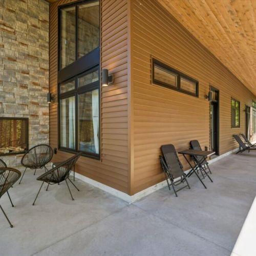 Relax under the covered patio with plenty of seating for the whole group.