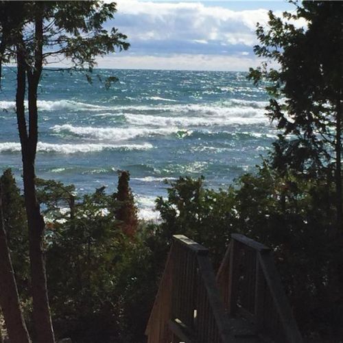 Steps down to the water with refreshing Lake Huron waves waiting below.