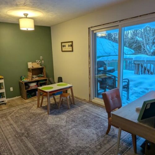 Bright multi-use room with sliding doors to the deck — great for games, reading, or relaxing.