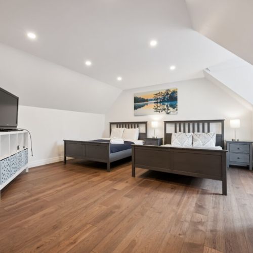Bedroom 2: Upper-level bedroom with king and queen bed. A quiet, private sleeping space