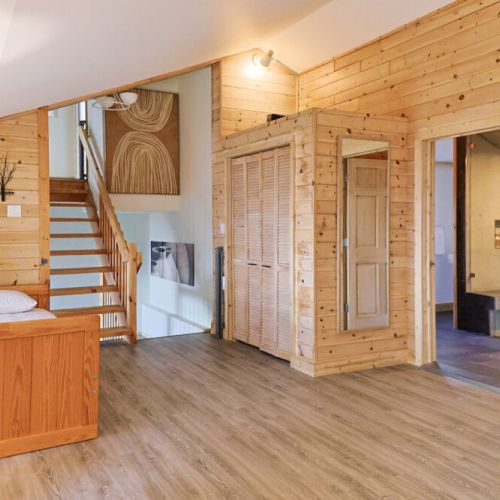 Nature-Inspired Comfort: Immerse yourself in the beauty of nature in this inviting space. The daybed provides a comfortable and convenient sleeping space, while the natural light and proximity to the washroom ensure a peaceful and relaxing stay.